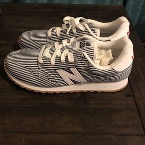 striped new balance shoes